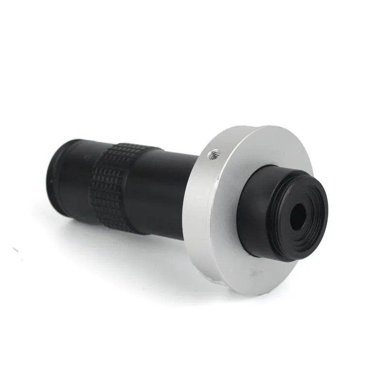 Black industrial monocular camera lens for 0.1-1.3X magnification with 60-300mm working distance.