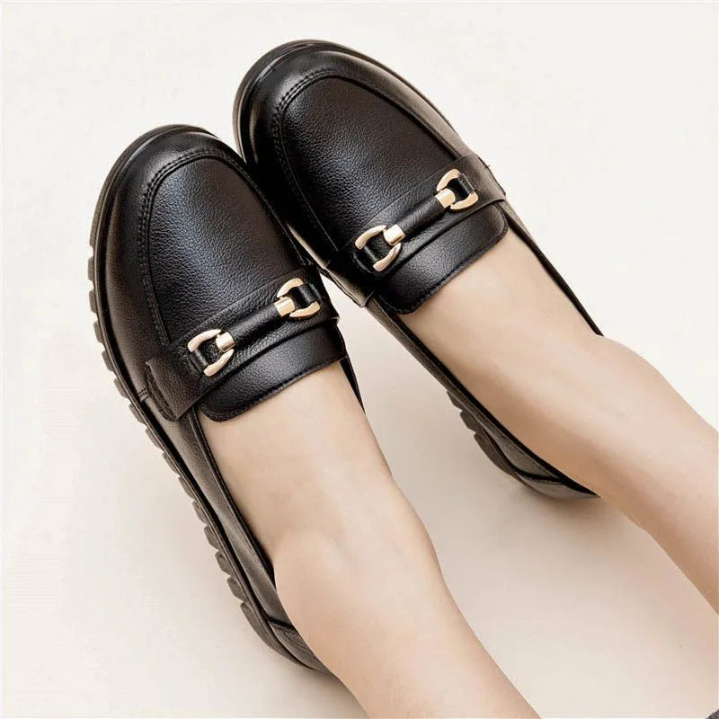 Black flat heel pumps with soft microfiber upper, round toe, and metal accent, low 1-3cm heel