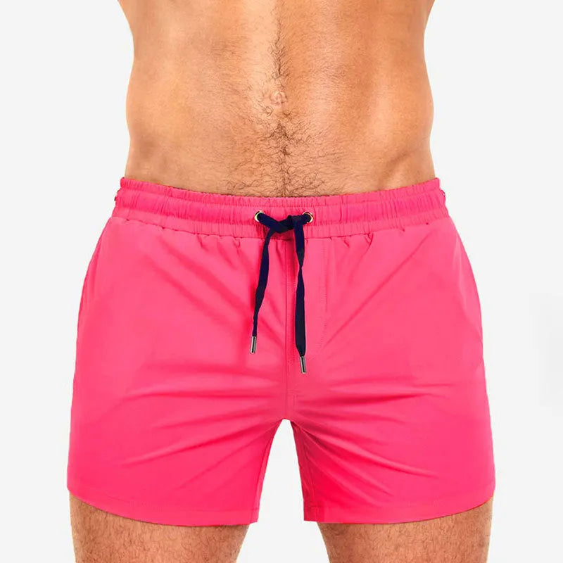 Mesh lining polyester sports shorts in army green, shown flat.