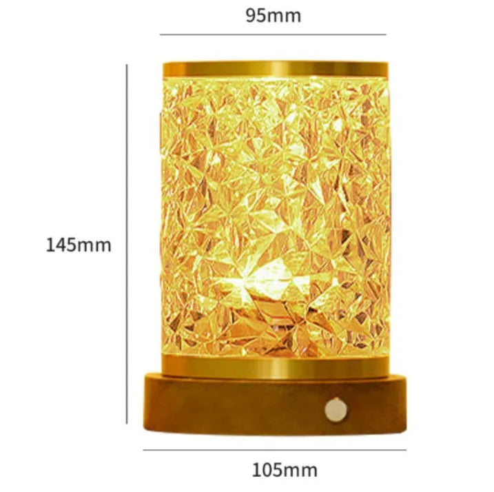 Rotating water ripple effect night light with acrylic body on a solid wood base.