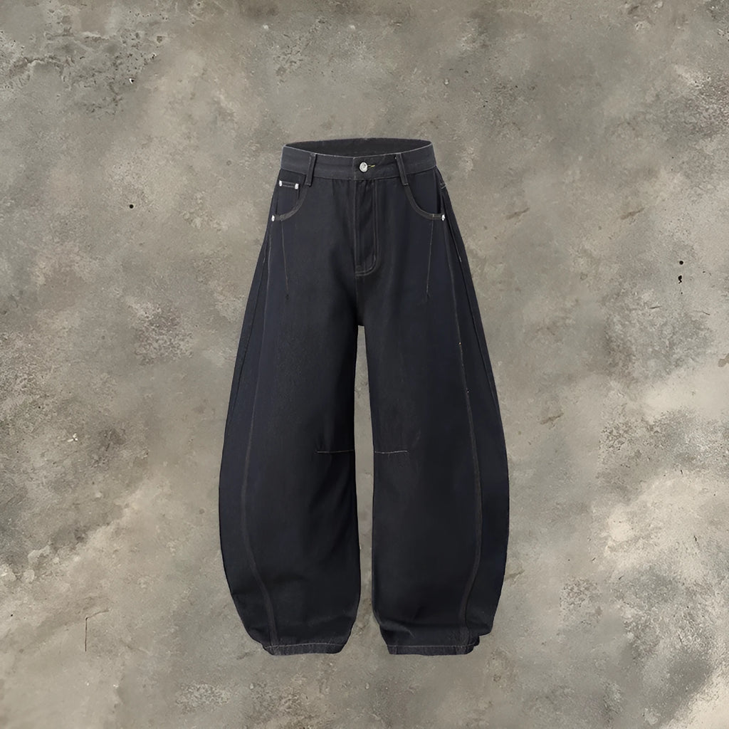 Men's wide leg denim trousers in original cow colour, showing mid waist and relaxed fit.