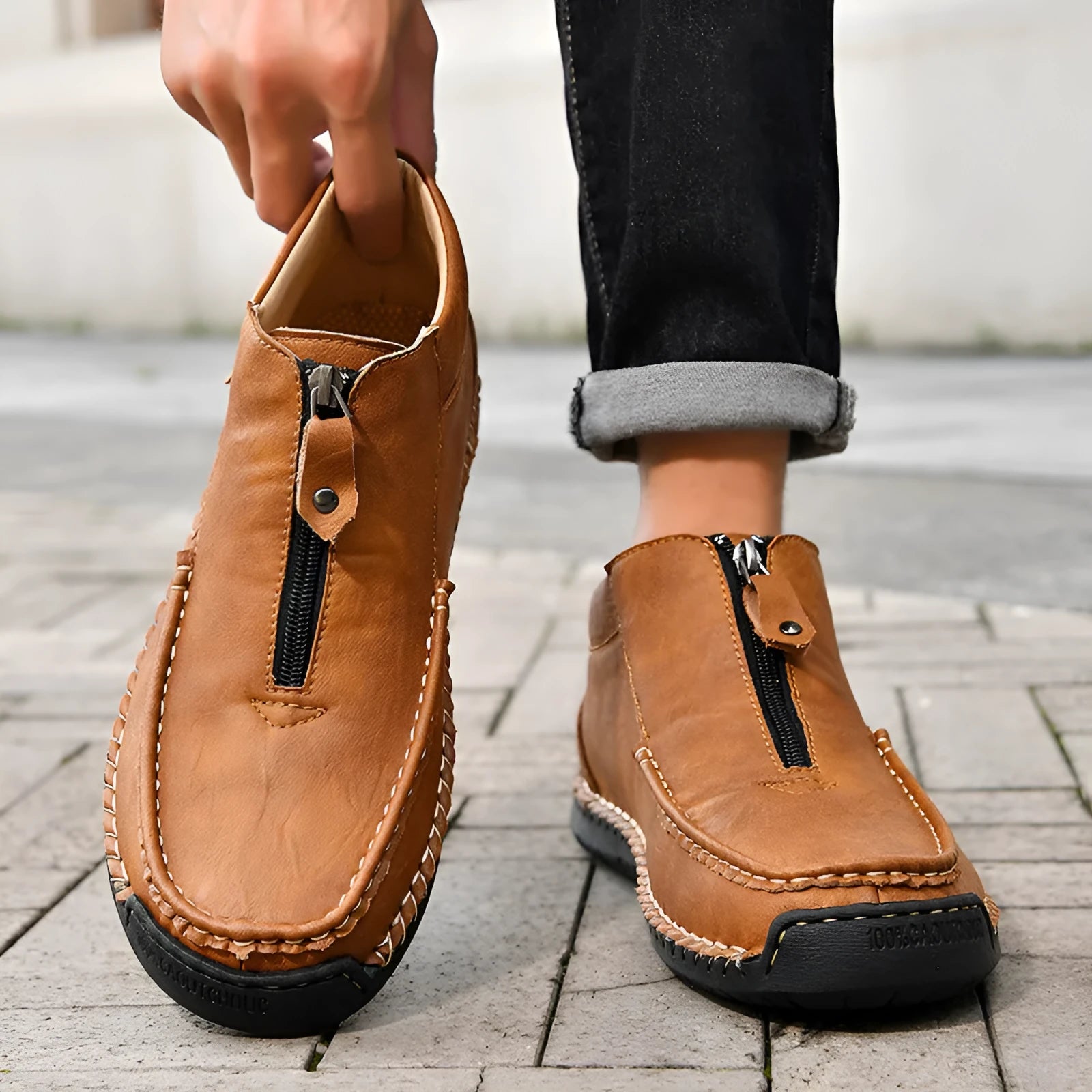 Men's black PU leather slip-on loafers with a round toe and sewn rubber sole on a white background.