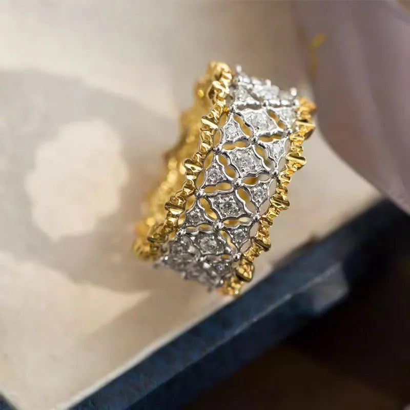 Two-tone gold colour geometric ring with a round zircon stone, showing front detail