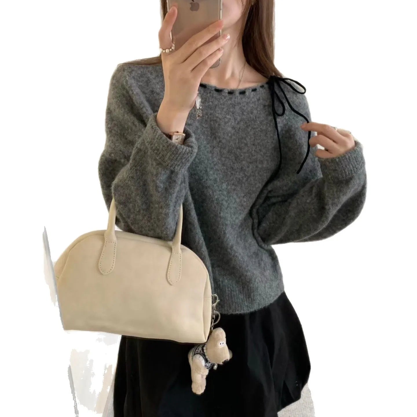 Grey loose-fitting women's knitwear pullover sweater on a hanger