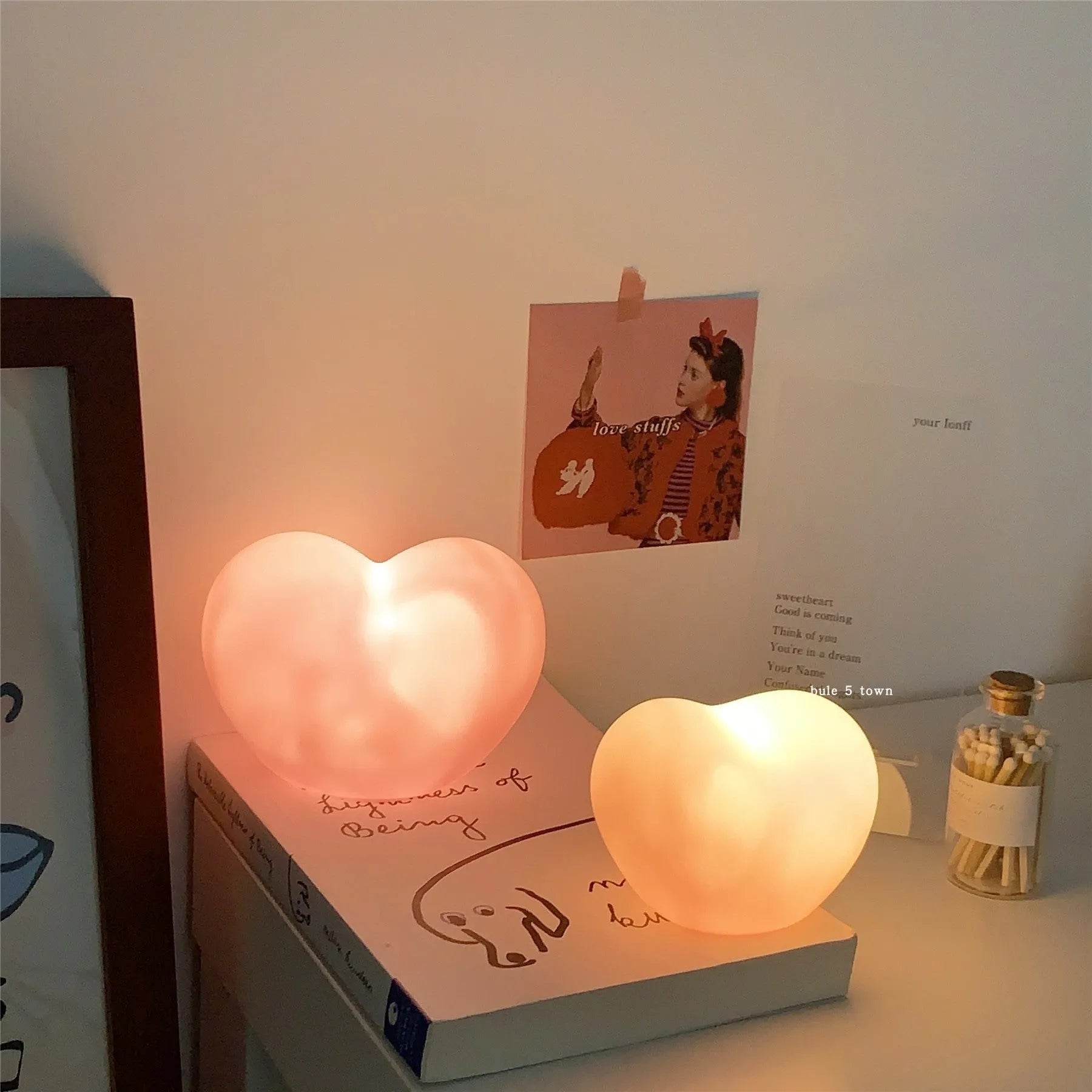 Pink and white vinyl atmosphere lamp creating a warm glow for decorative lighting.