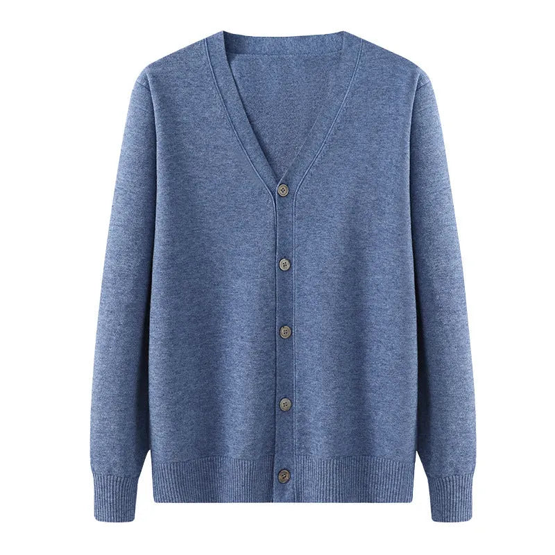 Man wearing a beige loose-fit V-neck Andy velvet knitted cardigan coat with long sleeves.