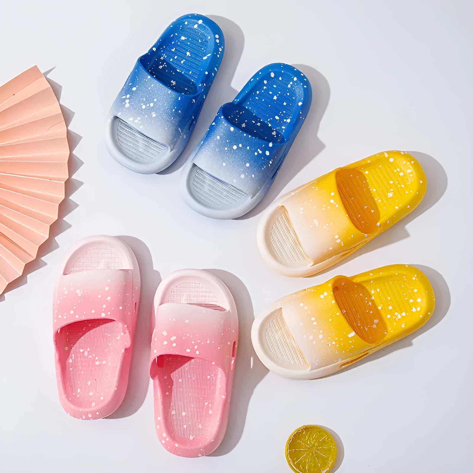 Gradient blue PVC slippers for children on a white background.