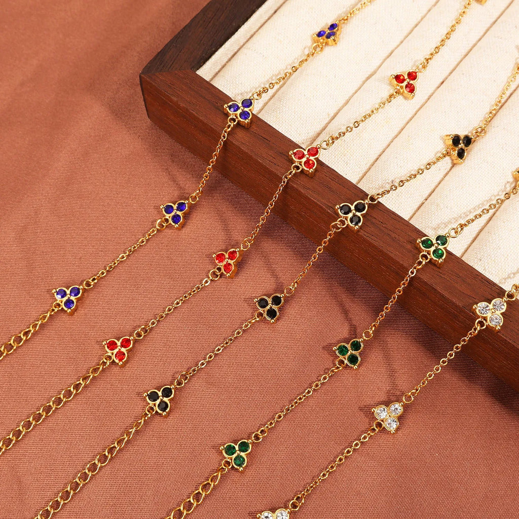 Stainless steel women's bracelet with three triangular zircon stones in a choice of colours and metal finishes.
