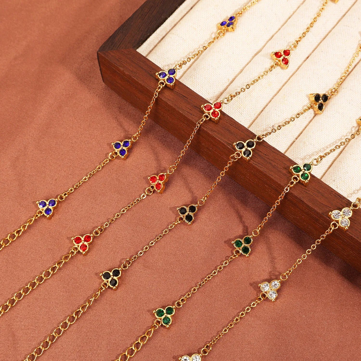 Stainless steel women's bracelet with three triangular zircon stones in a choice of colours and metal finishes.