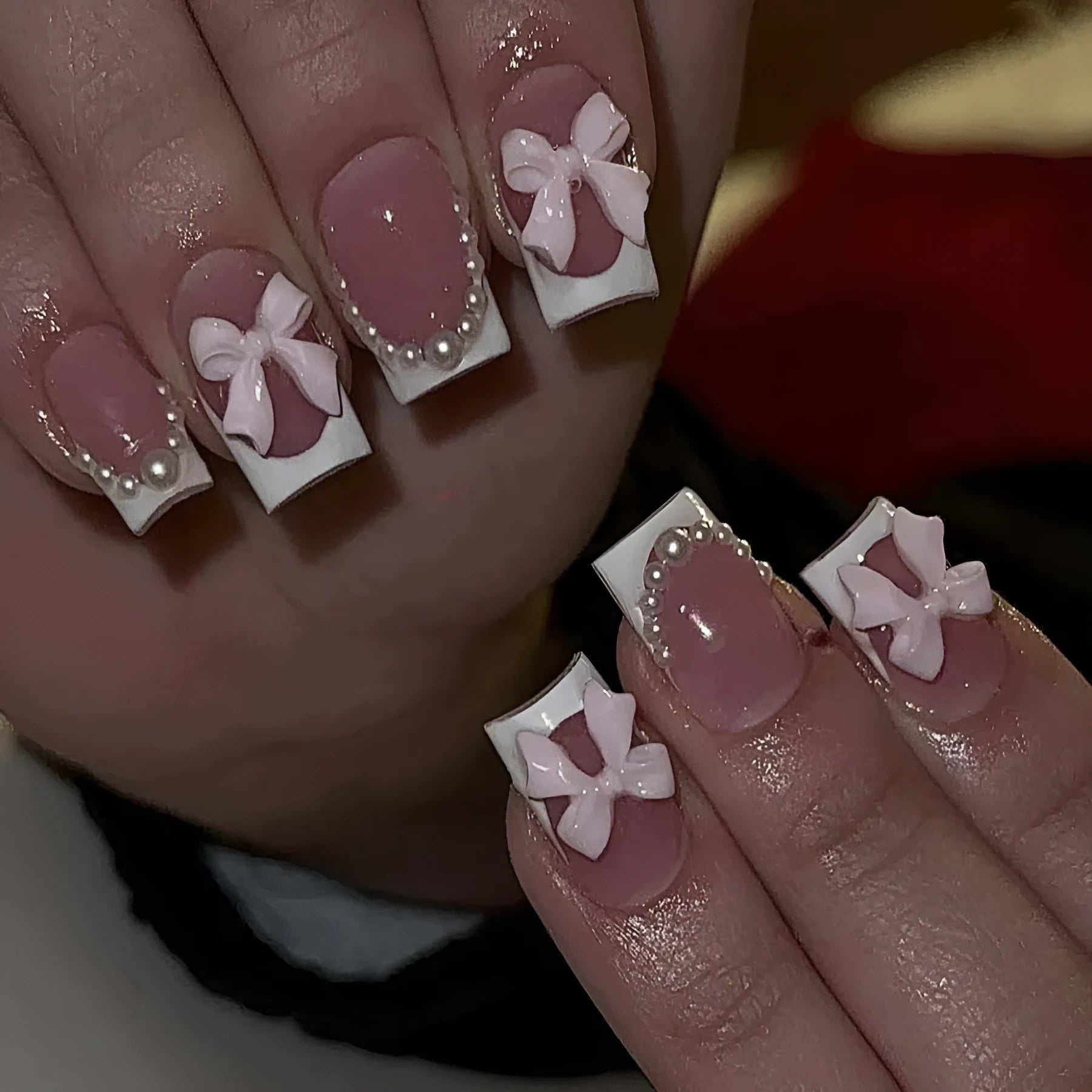 Short white French manicure press-on nails with decorative bow designs and European square shape