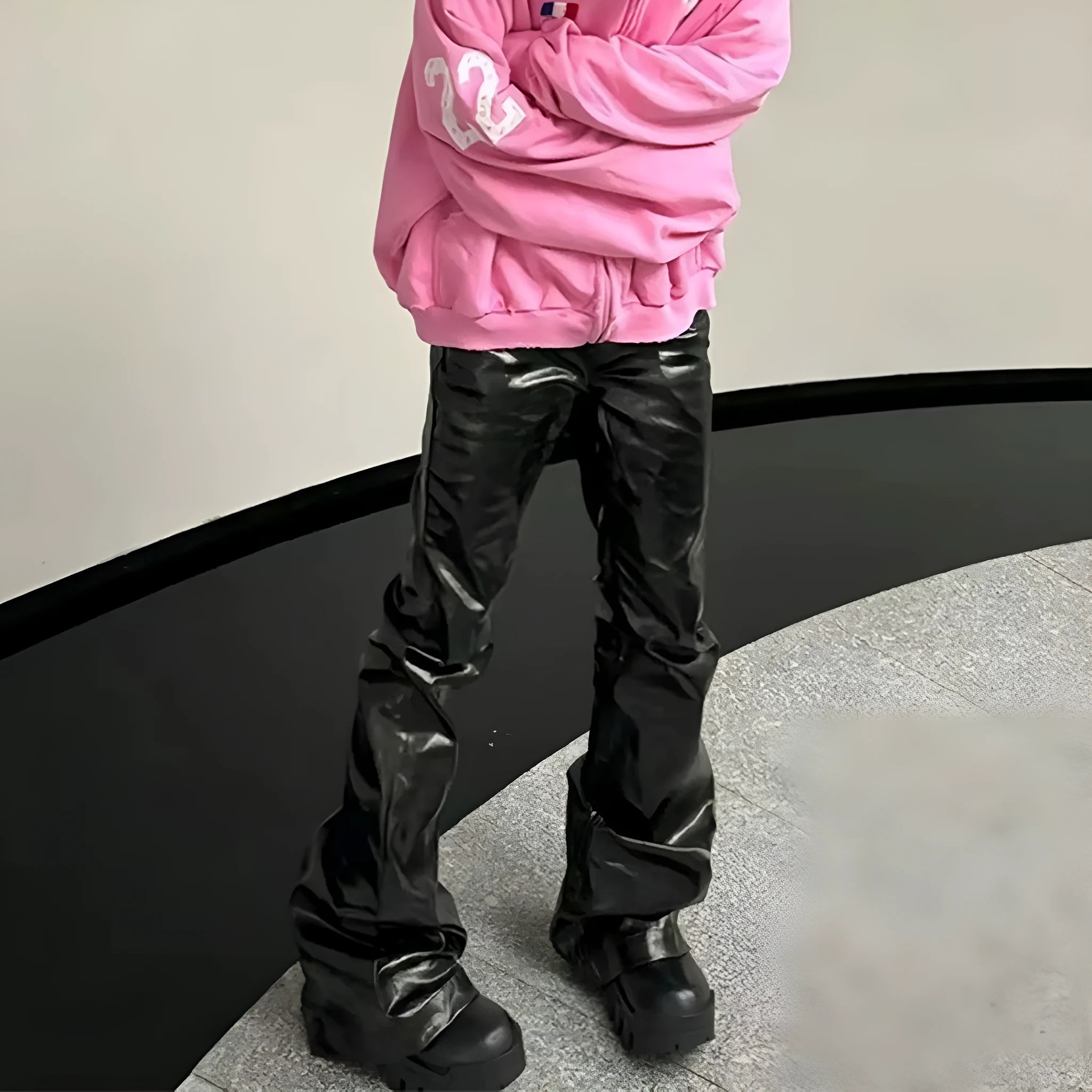 Black shiny patent leather skinny jeans for women in a straight-leg style.