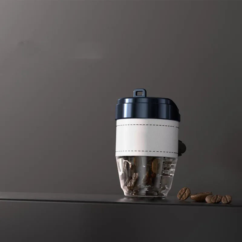 Coffee cup shaped plastic car air freshener in various colours on a car dashboard.