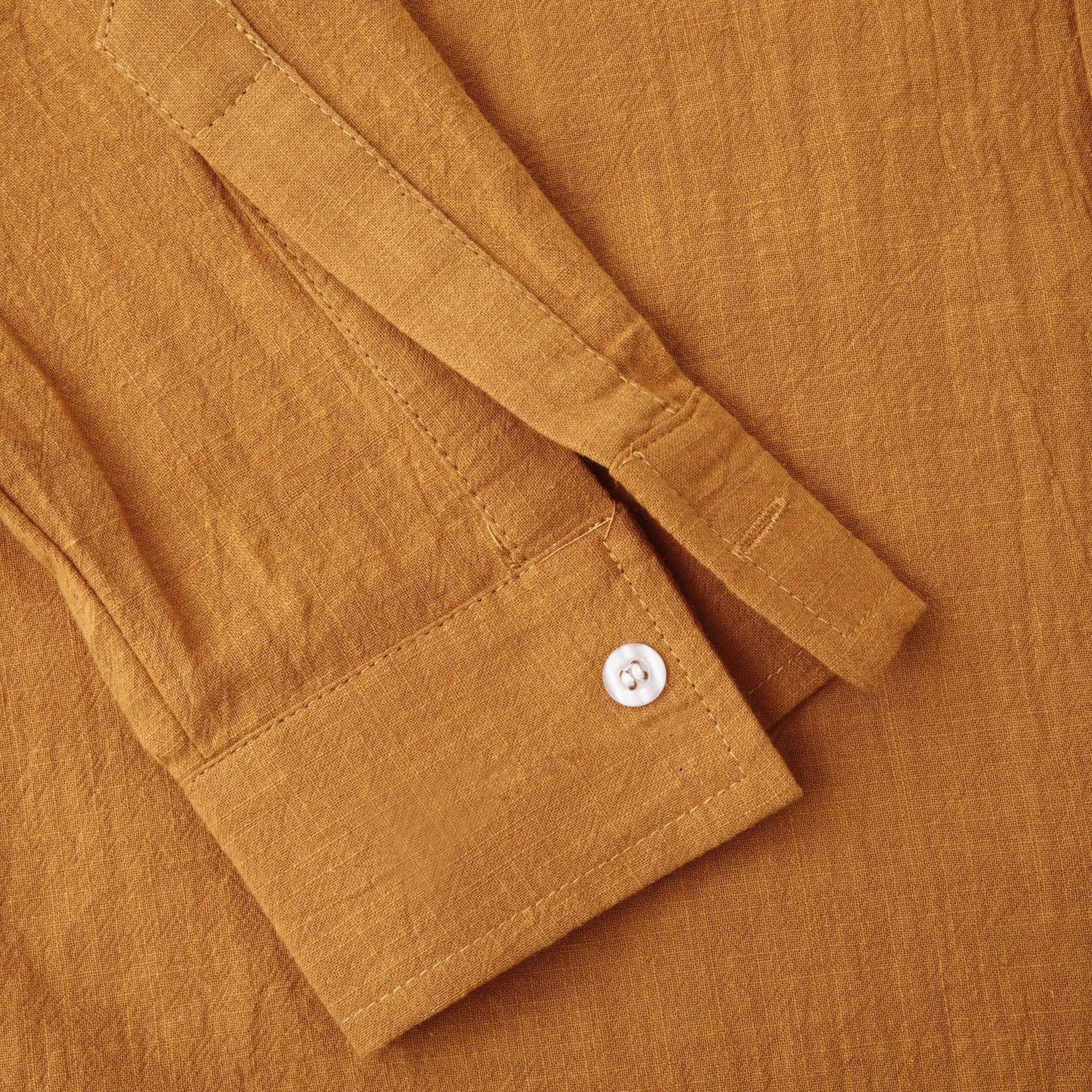 Men's slim solid brown long sleeve shirt and matching casual pants set on display