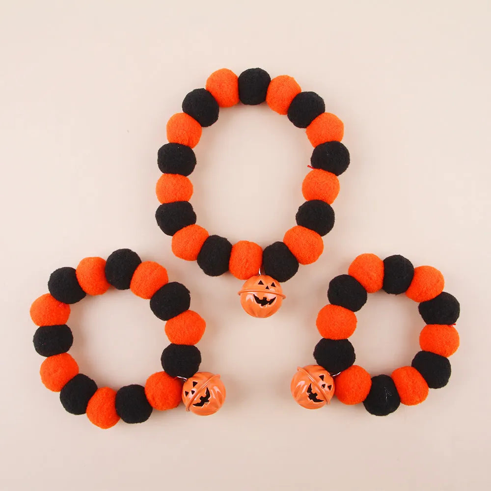 Funny orange pumpkin design cat collar with black details and an adjustable plastic buckle.
