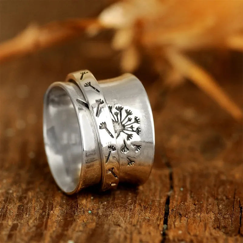 Silver electroplated rotatable flower ring showing floral design on alloy band