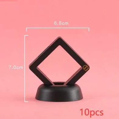 Transparent 3D floating display case holding a coin, with black and white size options