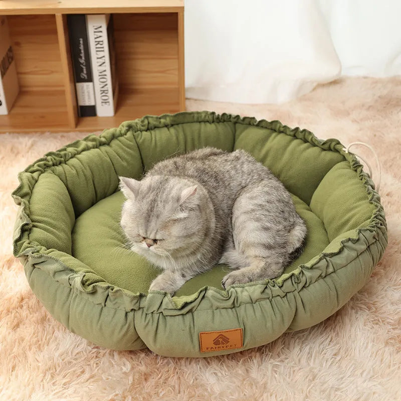 Reversible donut cat bed in grey or green available in three sizes for indoor pets
