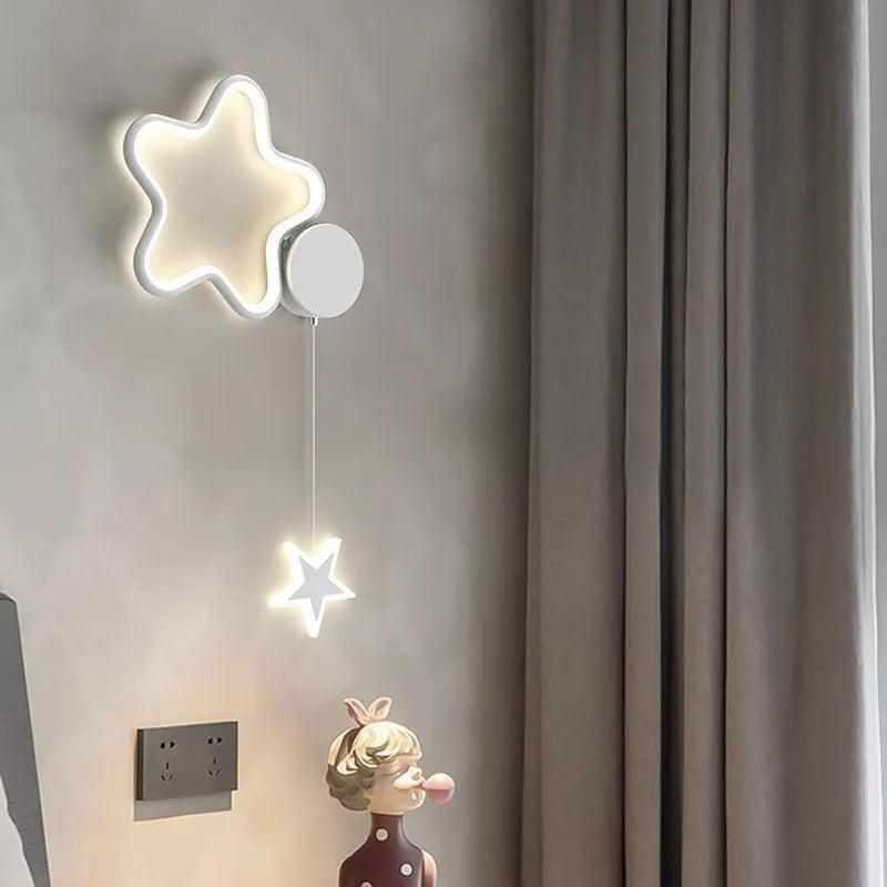Children's room wall lamp with five-pointed star and cloud design in white with left-facing cloud style and three-colour LED