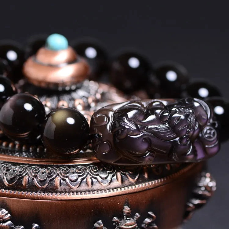 Polished natural icy obsidian Pi Xiu bracelet with ethnic geometric design