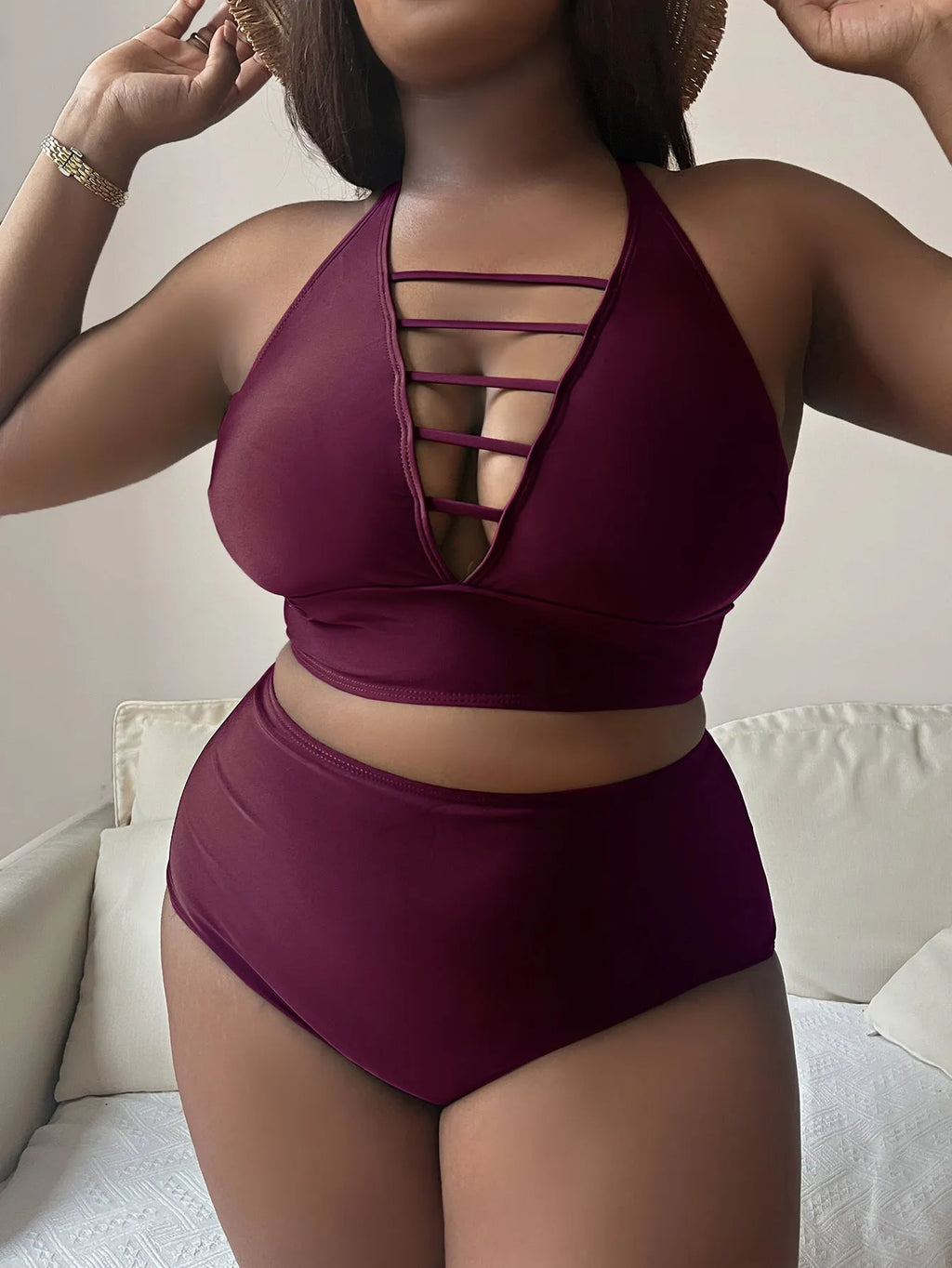 Plus size women's bikini with adjustable halter straps and high waist bottoms in solid colour