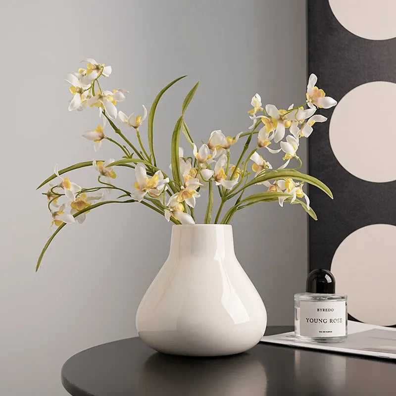 Ceramic decorative vase set with artificial orchid flowers in black or white coloured glaze finish