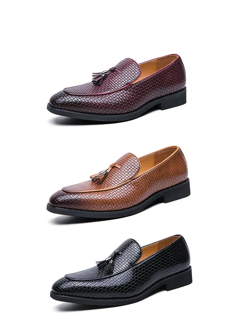 Men's black pointed toe slip on loafers with a tassel detail on the front.