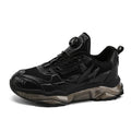 Men's black mesh casual sneakers with a rotating button closure and a low platform sole.
