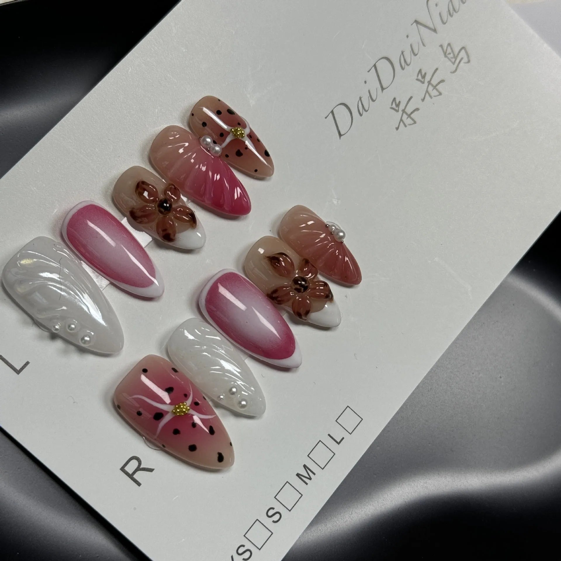 Hand-painted 3D carved nail art patches showing embossed cute patterns in four different sizes
