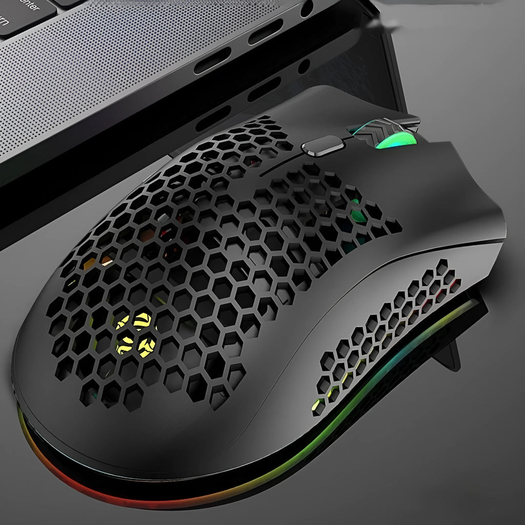 BM600 hollow-out luminous wireless gaming mouse in cyan, black, or white on a desktop.