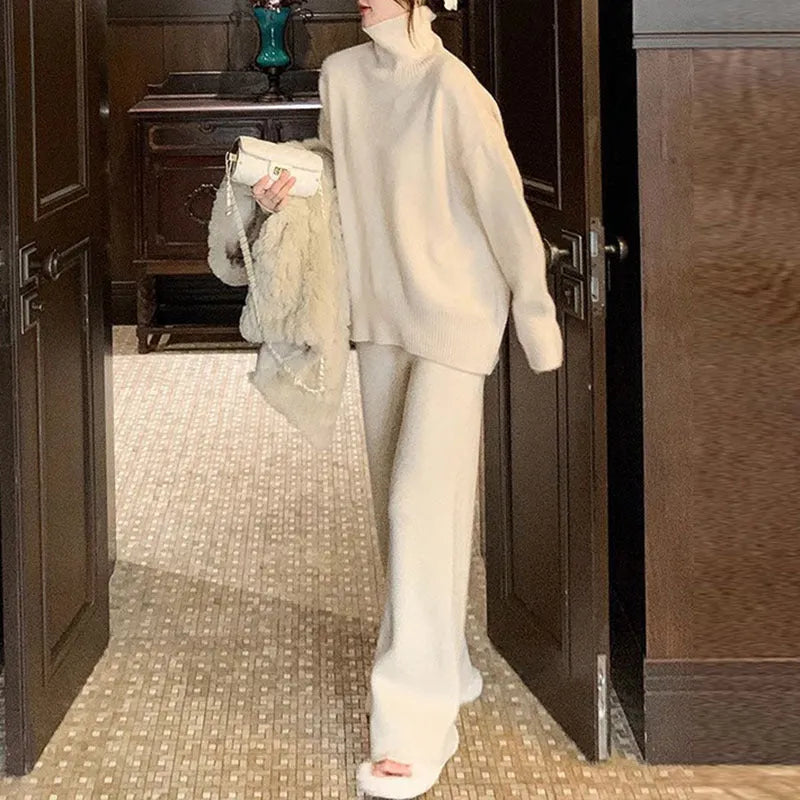 Women's casual two-piece set with long sleeve sweater and wide leg trousers in a solid colour.