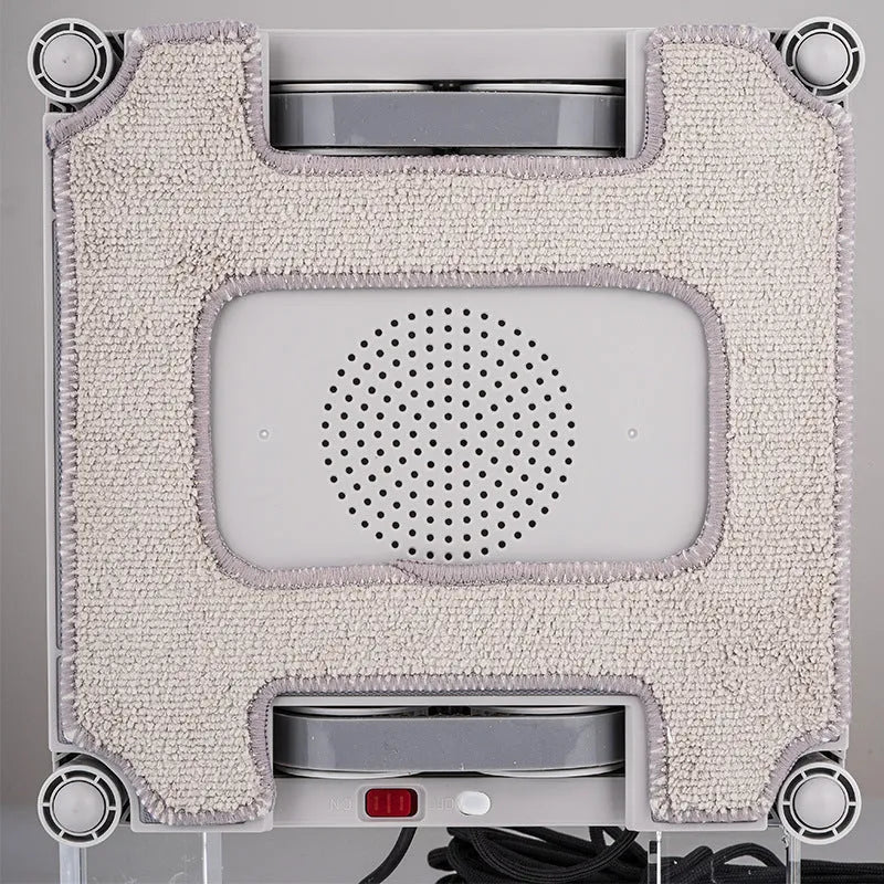 White electric window cleaning robot for automated high-rise window maintenance