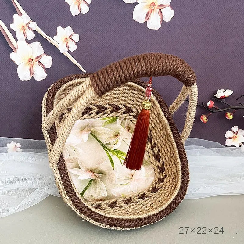 Hand-woven rustic straw basket in coffee brown colour, measuring 19cm by 12cm.
