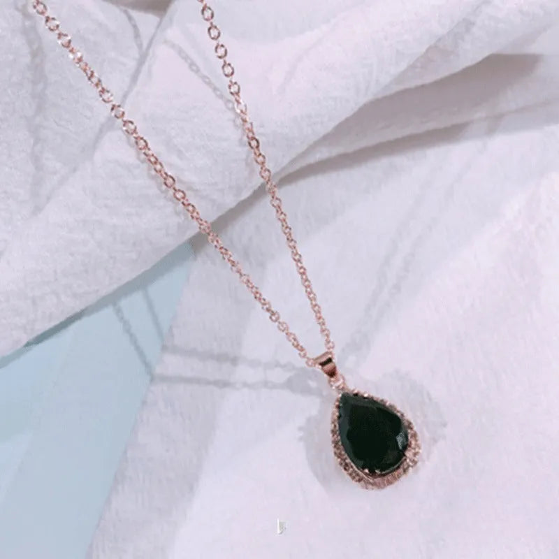 Women's drop shape necklace with rhinestone inlay and geometric design in pink colour option