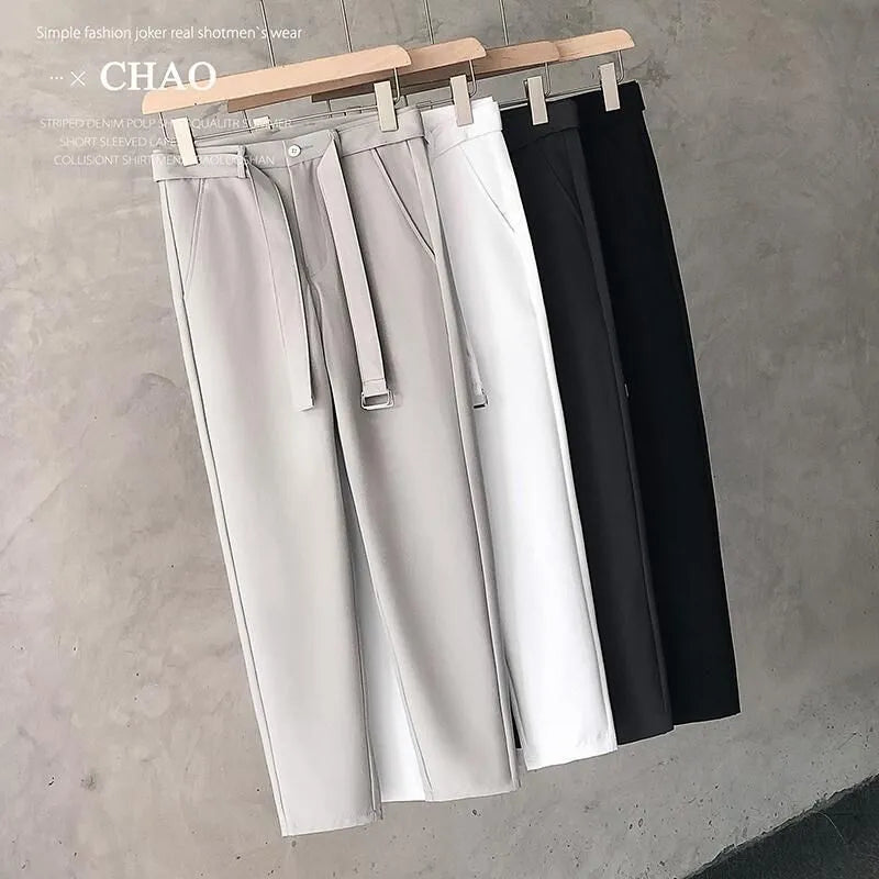 Boys slim straight wool trousers in black showing tapered cut and straight leg opening