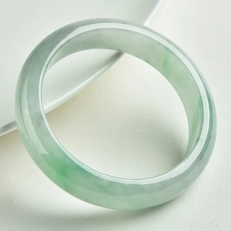 Natural jade bracelet light sun green colour unisex sizes 53 to 64