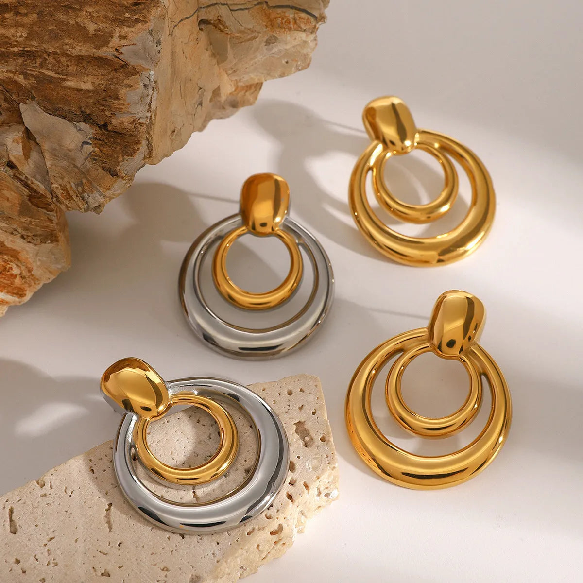 Round double layer hollow stud earrings with geometric design and 18K gold plated finish