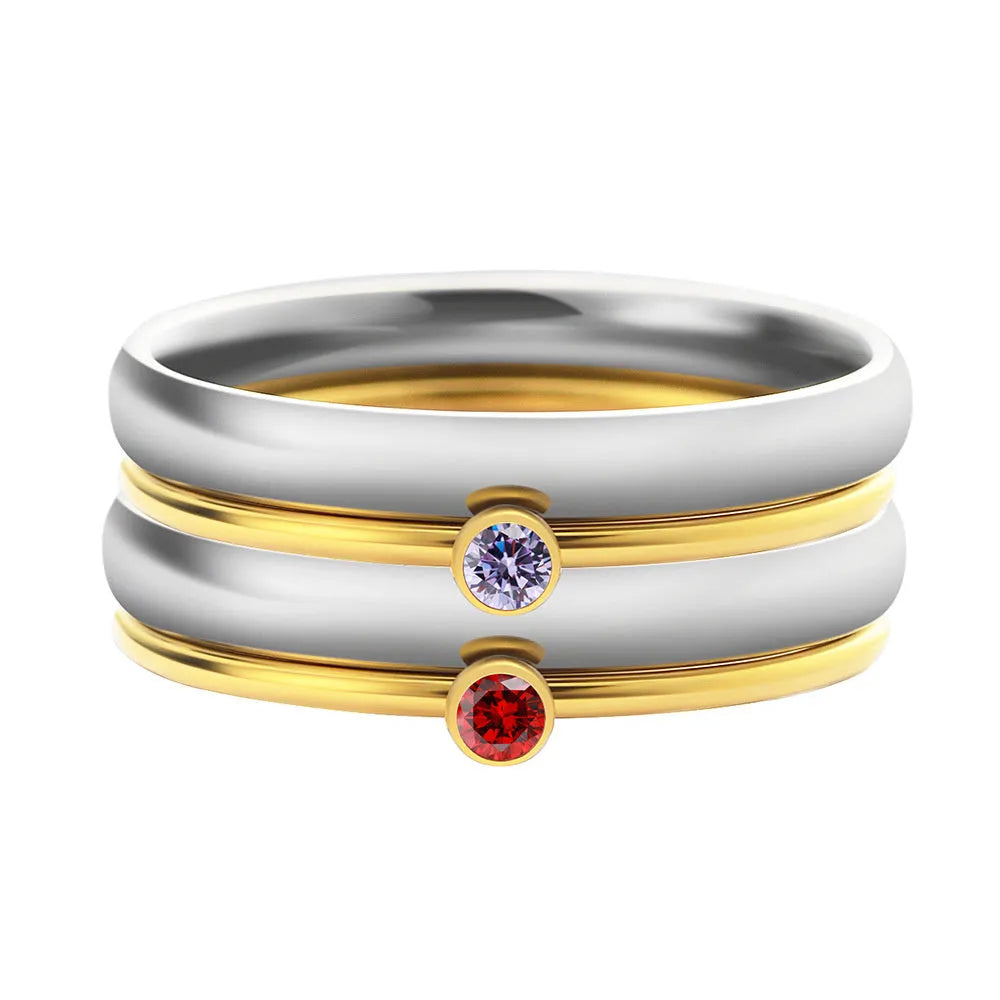 December birthstone engraved ring in titanium steel with gold accents and a geometry shape.