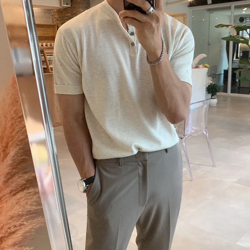 Man wearing a black thin slim-fit ice silk knitted short-sleeved bottoming shirt.