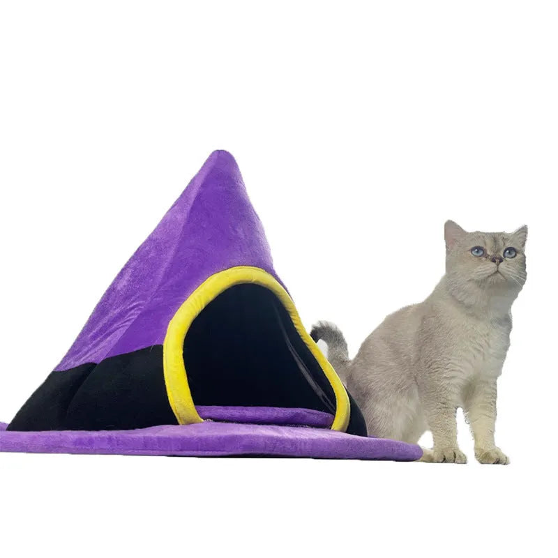 Purple cloth witch hat shaped cat bed for small cats, dimensions 60cm by 45cm.