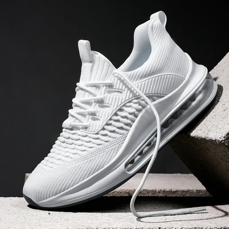 Men's black mesh low-top running shoes with white rubber sole on a plain background.