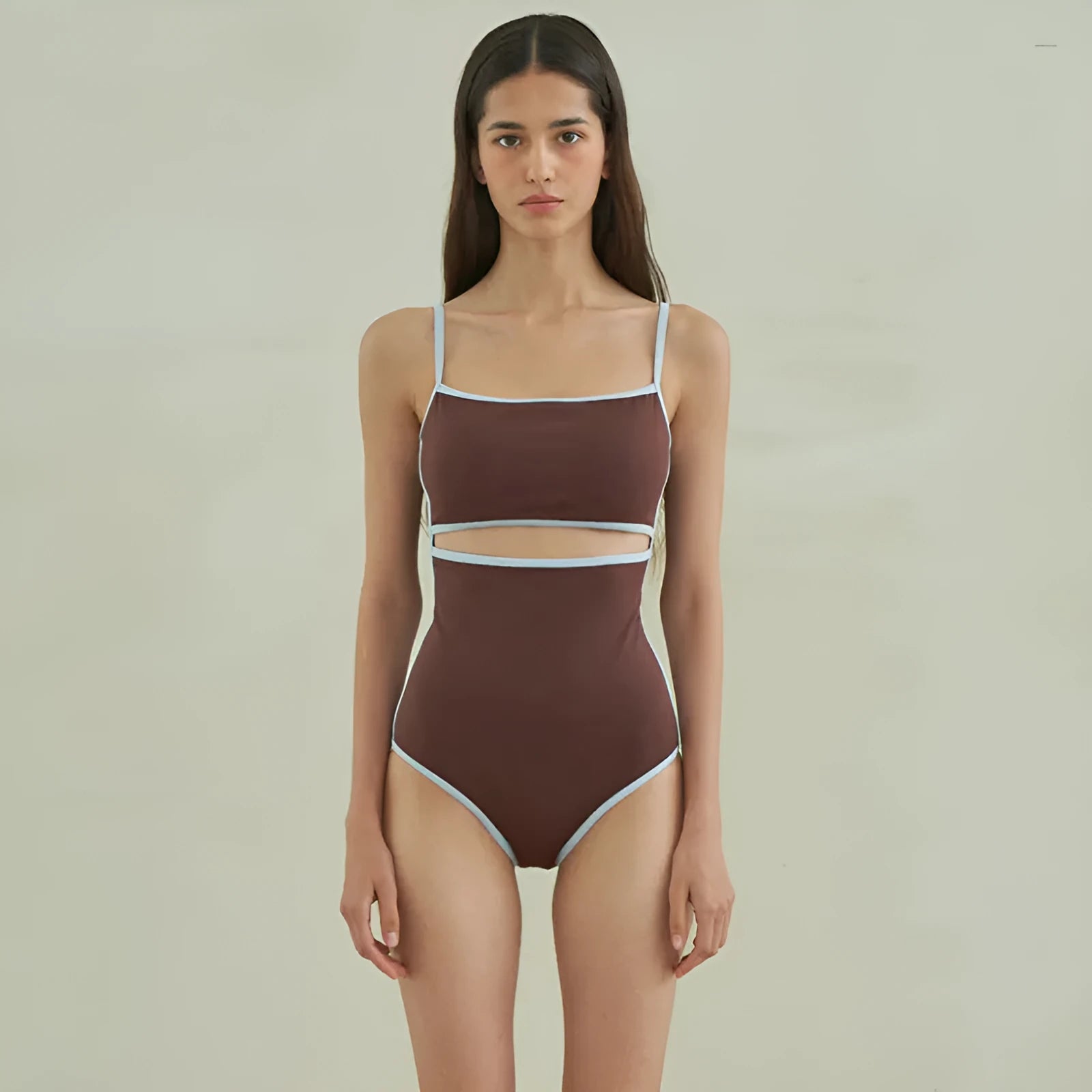 Brown women's one-piece swimsuit with triangle bust style on a mannequin.