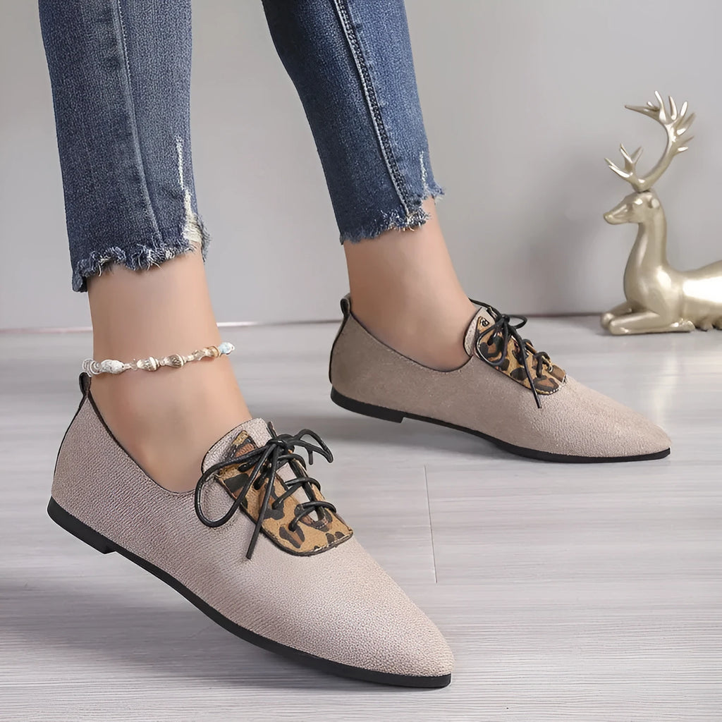 Beige leopard print women's plus size pointed toe pumps with a faux PU upper and rubber sole.