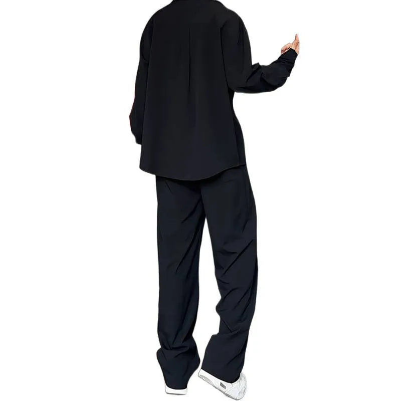 Men's black casual two-piece set with long sleeve polo shirt and matching trousers