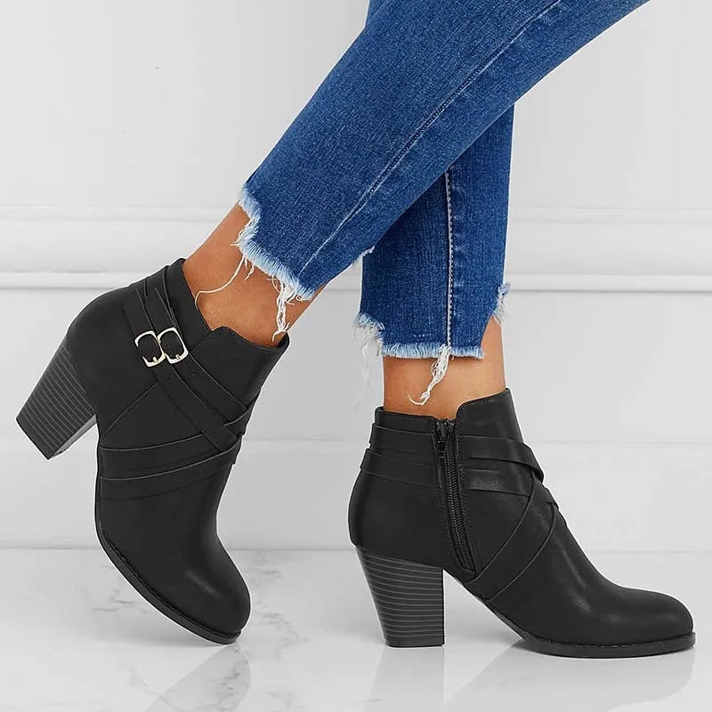 Plus size women's short boot with a 7cm stout heel and side zipper in black.