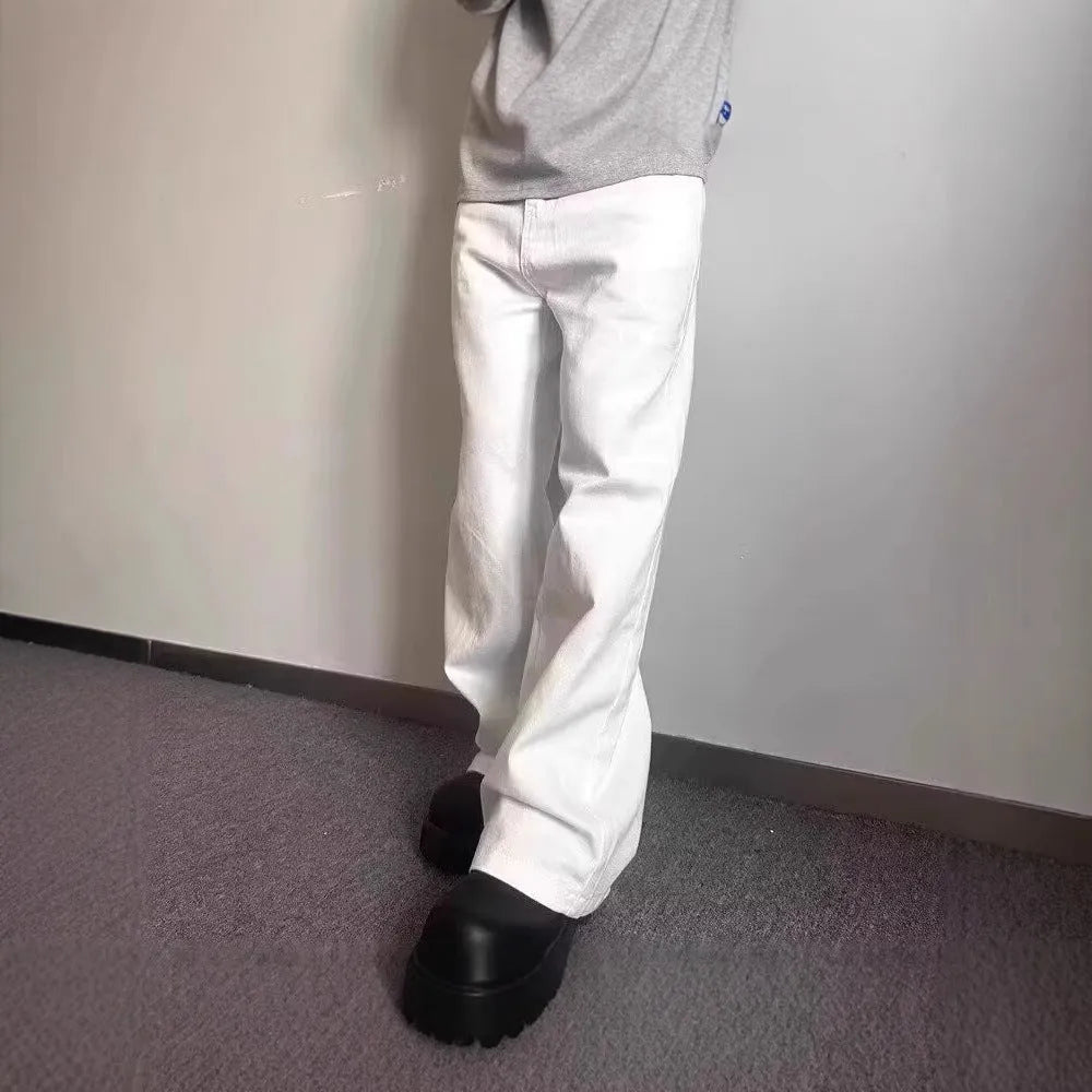 Men's white straight-leg wide fit cotton denim jeans on a neutral background.