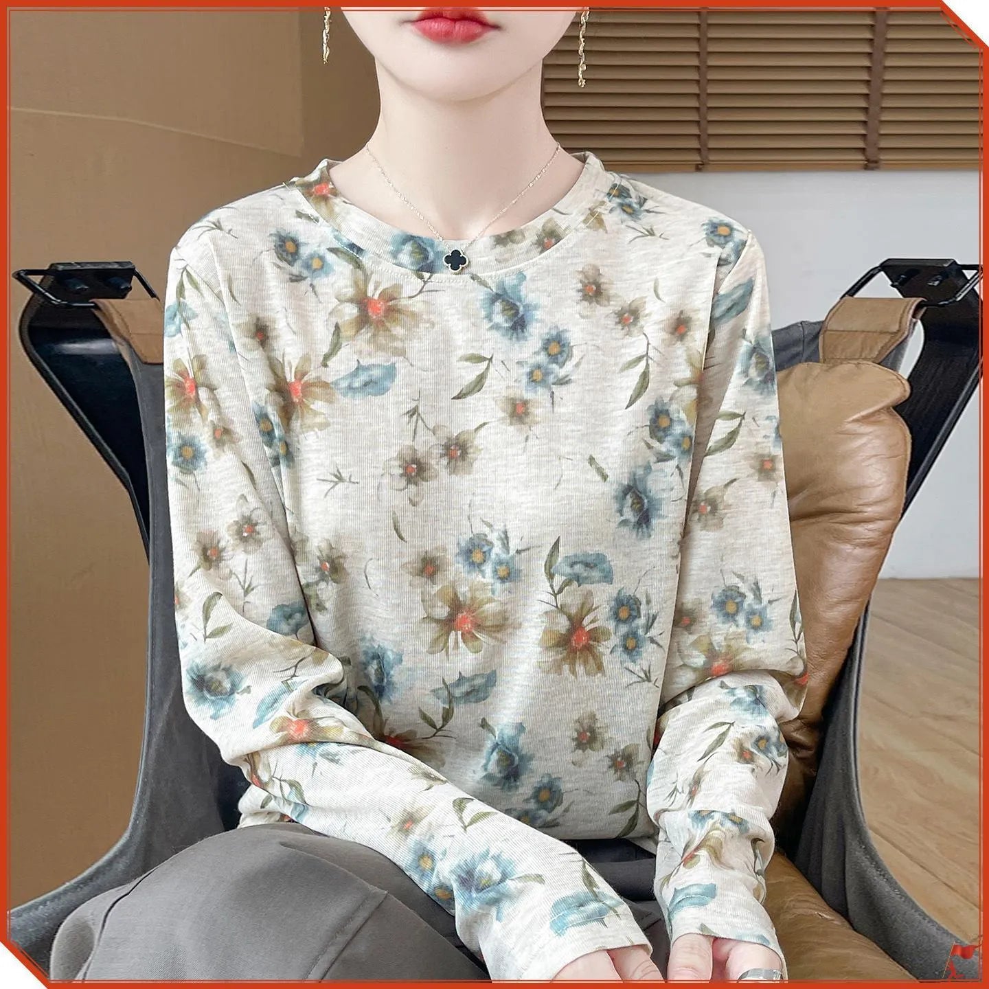 Women's round neck Tencel cotton pullover shirt in a floral print, showing front view.