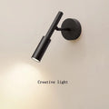 Modern wrought iron wall lamp in black or white with three light colour options