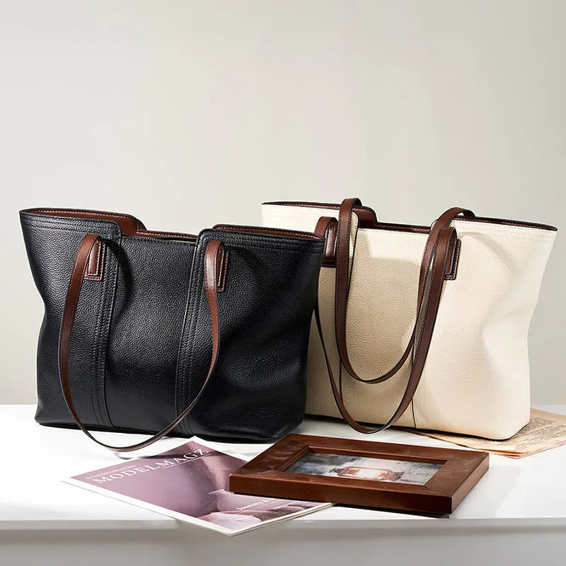Women's black genuine cowhide leather commuter shoulder bag with horizontal square shape and multiple internal compartments