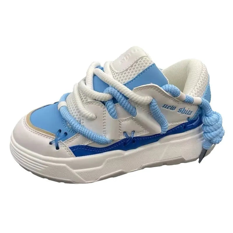 Women's grey chunky platform sneakers with thick rubber sole and lace-up front