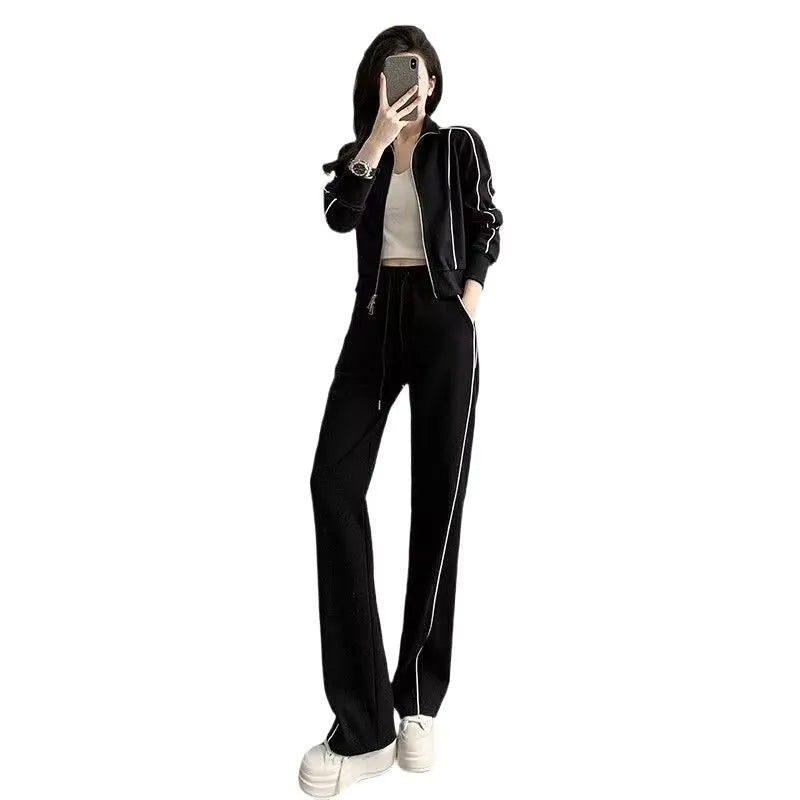 Women's two-piece set with short zipper sweater and wide leg trousers in solid colour polyester, black and white options available